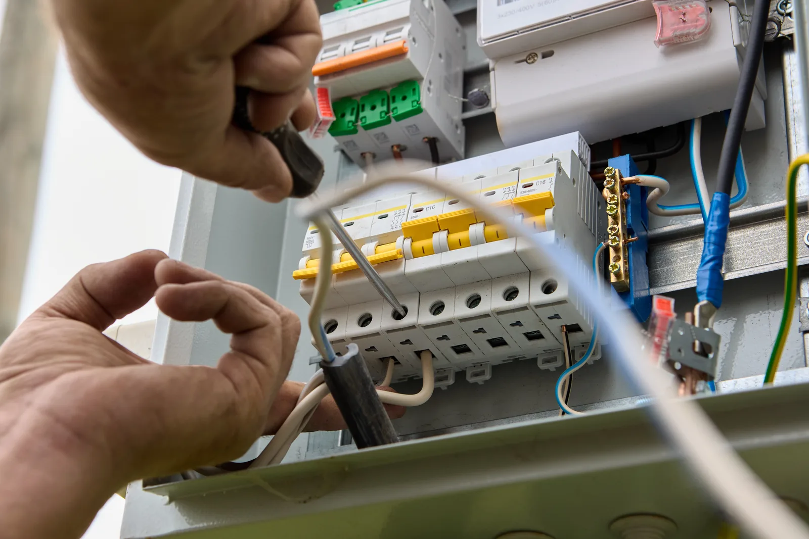 Hands-on switchboard repair in progress