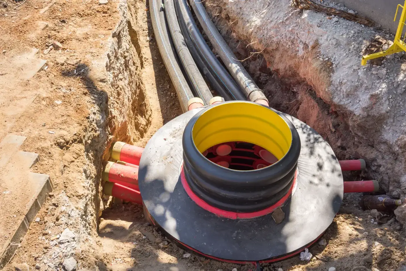 Underground consumer mains conduit being installed